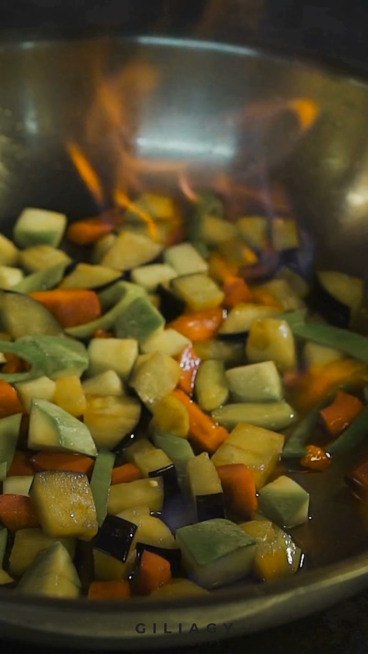 High-speed frame of vegetables searing in a pan